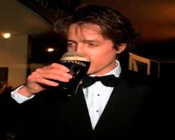 Hugh Grant consuming alcohol